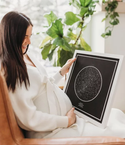 A Pregnant Women is looking at a Star Map