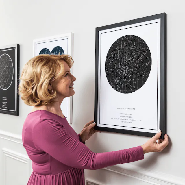 A Women Hanging Several Star Maps