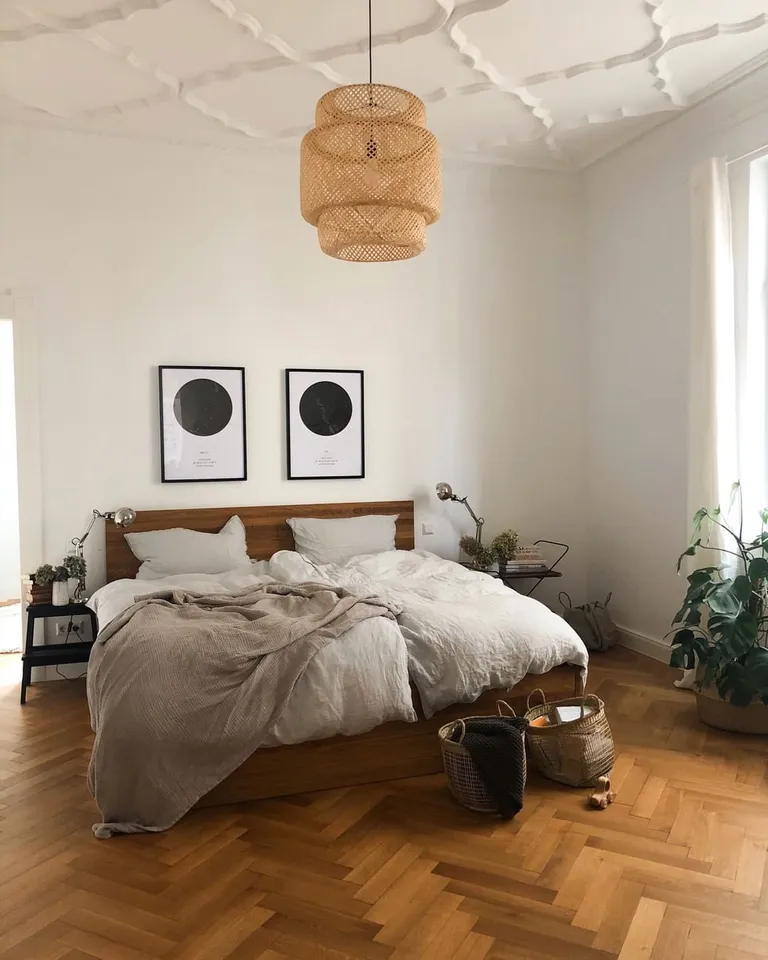 Two Star Map hung on the wall behind a Bed